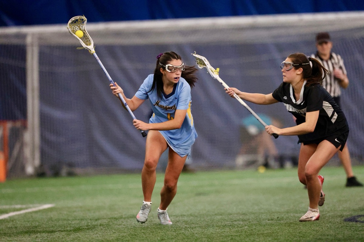 Dani Serrano playing lacrosse for Marquette University